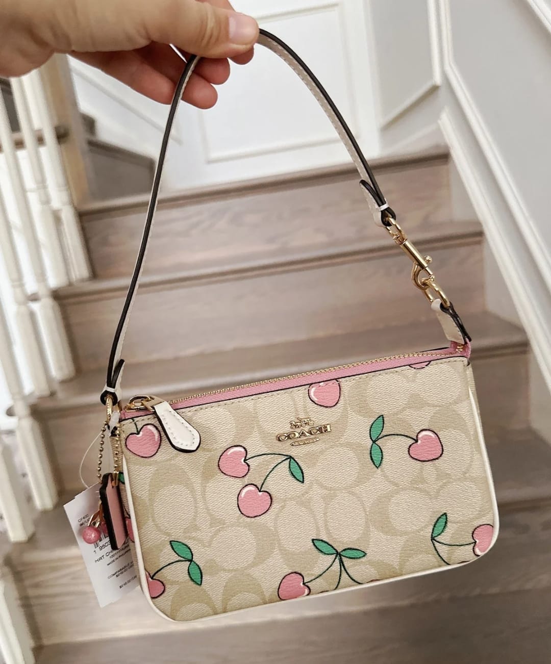 CO-A-CH FLORAL SLING BAGS